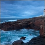 slides/Rubh Re Lighthouse 3.jpg rub re lighthouse,scotland,coast,ocean,water,misty,rocks,surf,crashing,red rock,clouds,sunset, motion, movement,panoramic Rubh Re Lighthouse 3